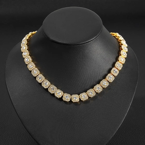Close-up of a gold alloy tennis necklace with square blue sapphire zircon stones