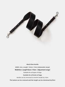 Close-up of adjustable 4cm wide black leather strap with silver metal hooks for bags