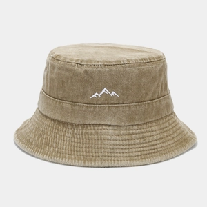 Detailed view of white mountain embroidery on khaki washed cotton bucket hat