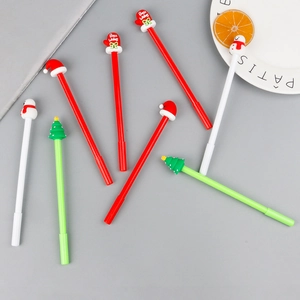 Set of 7 Christmas gel pens with snowman, tree and Santa hat toppers in red and white