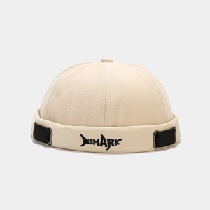 Beige canvas docker hat featuring black shark embroidery and adjustable side strap