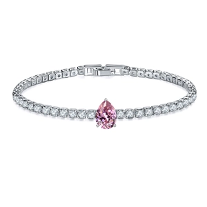Detailed close-up of a silver tennis bracelet with a pink pear-cut stone and pavé zircon