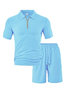 Close-up of bright blue men's polo set showing intricate woven texture and zipper detail