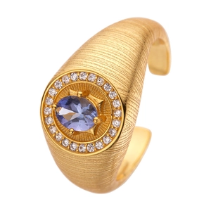 Vintage gold S925 silver ring with oval tanzanite gemstone and zircon halo on white background