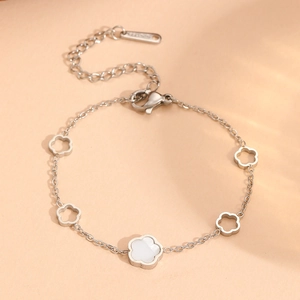 Silver stainless steel bracelet with cutout flowers and white shell inlay for women