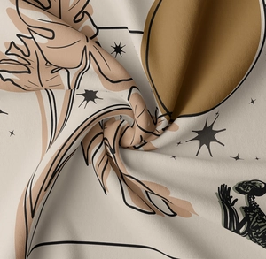 Close-up of decorative skeleton tapestry fabric showing leaf patterns and soft texture