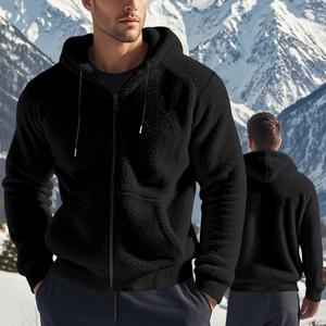Detail of warm black fleece hoodie showing plush texture and winter zip-up design