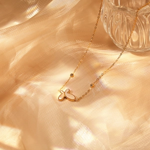 Elegant gold butterfly necklace with white mother of pearl inlay and sparkling zircons
