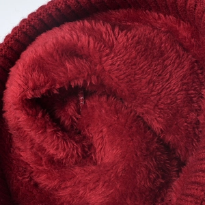 Thick burgundy knit hat with warm plush lining for winter outdoor protection and comfort