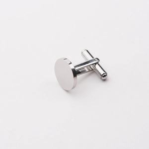 Detailed view of the circular silver cufflinks with polished finish and swivel back