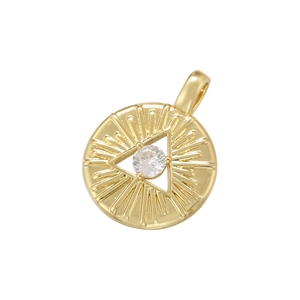 Macro detail of golden round pendant with triangle center and radial sunburst patterns
