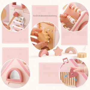 Detail of wooden activity house showing xylophone and shape sorter for toddlers