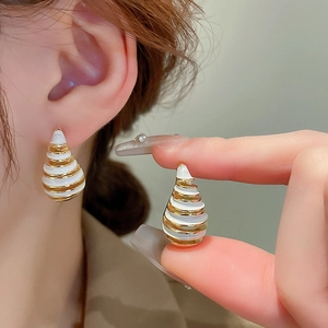 Modern white enamel conch spiral earrings with premium gold plating for women