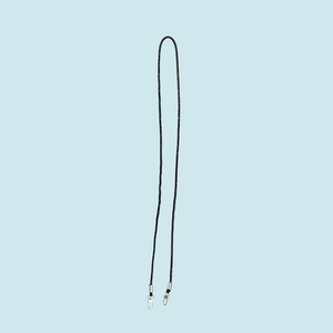 Close-up of a long black rhinestone phone strap with a metallic spring clasp on blue background