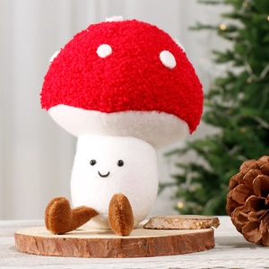 Cute plush mushroom doll with red spotted cap on wooden base for Christmas decor