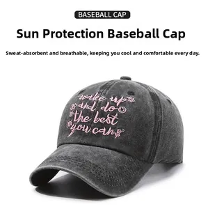 Detail of vintage washed cotton baseball cap featuring pink floral and quote embroidery