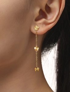 Detail of 18K gold-plated stainless steel long tassel earrings with three floral motifs