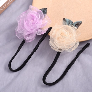 Detailed view of lavender and beige organza flower bun makers with flexible wire loops
