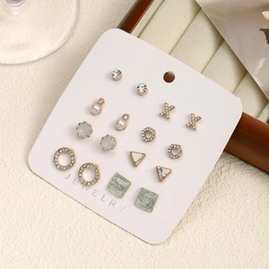 Set of 9 pairs golden stainless steel earrings with pearls, rhinestones and marble studs