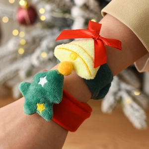 Christmas plush snap bracelets set with festive tree and bell decorations on model wrist