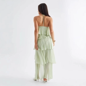 Elegant light green halter neck tiered ruffle dress with backless design for summer vacation