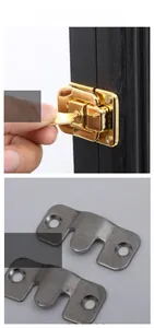 Detail of golden polished lock with key and stainless steel mounting brackets for frames