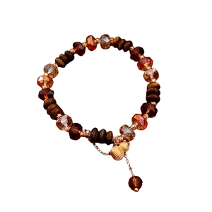 Bracelet vintage en perles d'œil de tigre avec pendentif gourde dorée au style ethnique