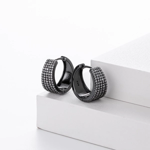 Detailed macro view of black s925 silver hoop earrings featuring micro-paved zircons