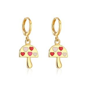 Macro detail of gold-plated mushroom earrings with red and pink heart patterns