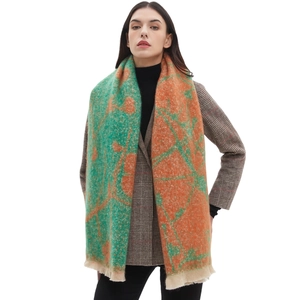 Women's chunky knit floral scarf with orange and green patterns and fringe trim