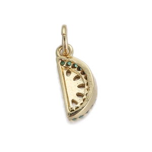 Detailed macro of a 14k gold-plated watermelon pendant with green and pink enamel