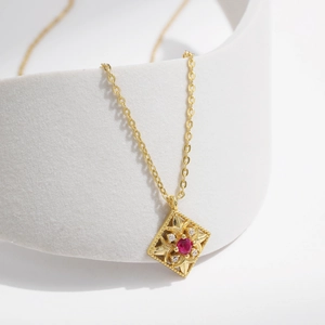 Elegant gold S925 sterling silver necklace with hollow diamond pendant and red gemstone