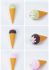 Detail of three-color artificial ice cream cones with realistic cream topping and sprinkles
