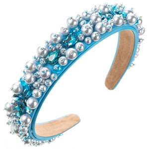 Detail of sky blue satin headband with white pearls and blue crystal embellishments