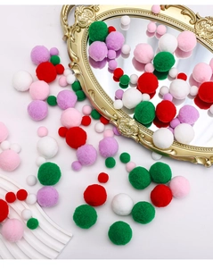 Close-up of multi-color fluffy pom-poms for Christmas DIY crafts and gift decoration