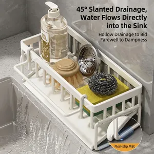 White kitchen sink organizer with 45-degree sloped drain tray for sponges and rags