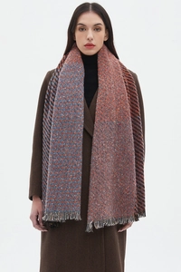 Detailed view of orange and blue knitted scarf with checkered pattern and fringe edges