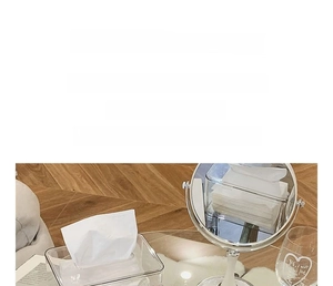 Close-up of clear PET tissue box showing high transparency on a wooden floor