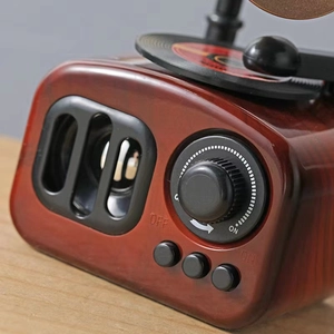 Retro gramophone style bluetooth speaker in mahogany wood grain with rotary knob controls