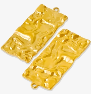 Detail of two gold 304 stainless steel irregular wrinkled rectangular charms with jump rings
