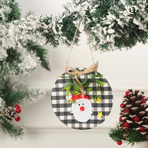 Detail view of round buffalo plaid Christmas door sign with felt Santa Claus applique