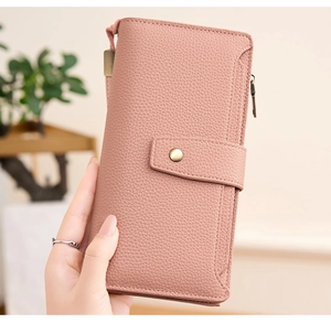 Pink pebbled leather long wallet with snap button strap and zipper pocket detail