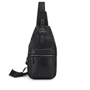 Close-up of black genuine leather chest bag featuring multiple zipper compartments