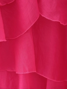 Detail showing tiered layers of magenta chiffon ruffles with neat edge stitching
