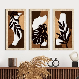 3-piece wooden leaf wall art set with botanical silhouettes in a minimalist home interior