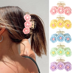 Pink camellia flower claw clip hair accessory in five pastel colors for women