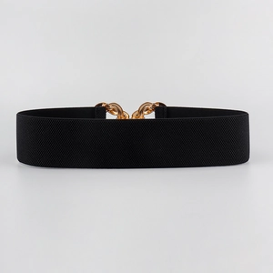 Detail of wide black elastic belt featuring a polished gold interlocking metal buckle