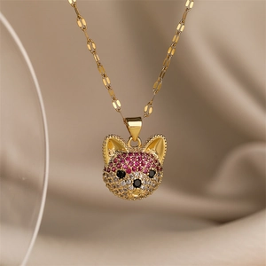 Close-up of golden dog head pendant with inlaid colorful rhinestones on flat chain