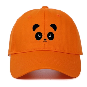Close-up of cute panda face embroidery on high-quality orange cotton baseball cap fabric