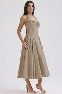 Detail of khaki halter neck dress showing corset-style bodice and pleated waist design
